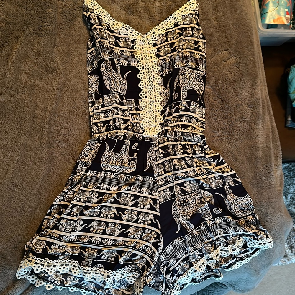 Purchased in costa rica from pop up shop fits like a small. Romper